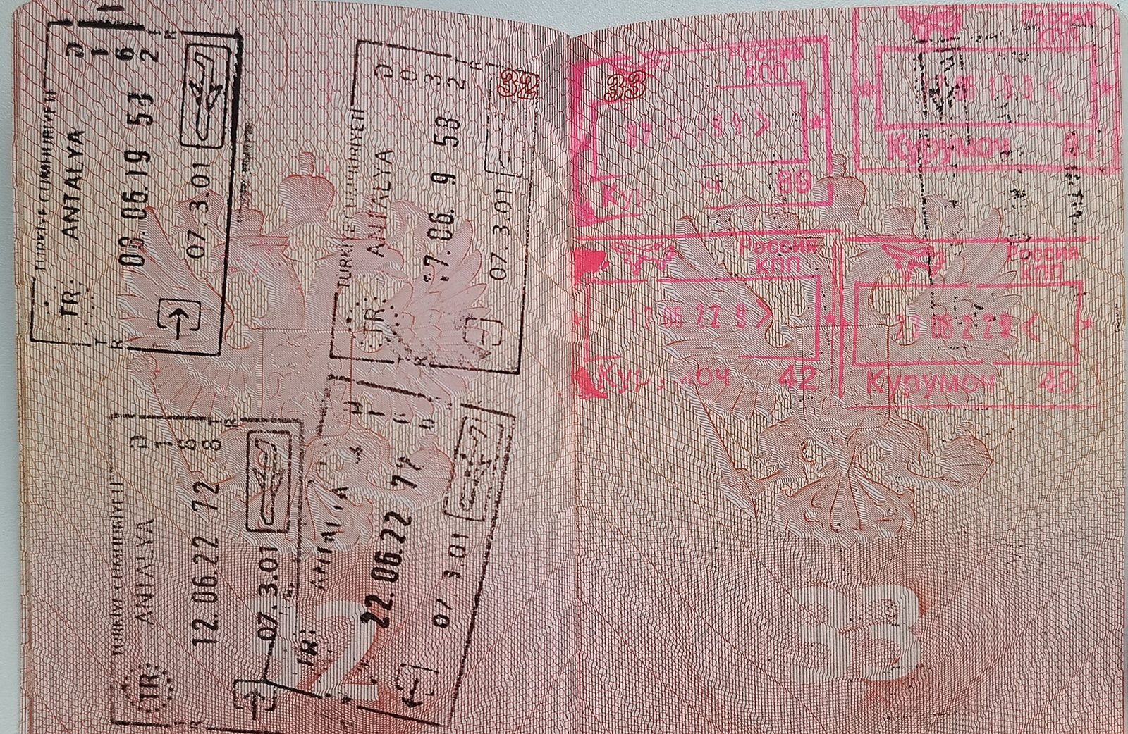 Close-up of a passport and entry stamps